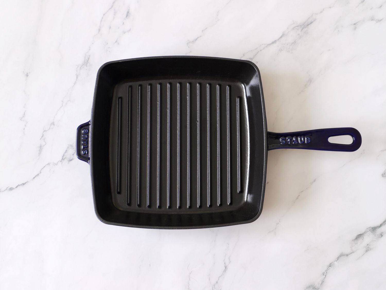 staub grill pan on marble countertop