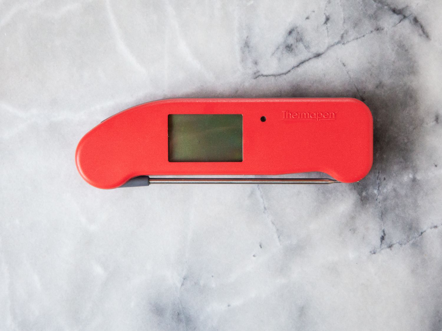 red thermapen one on marble countertop