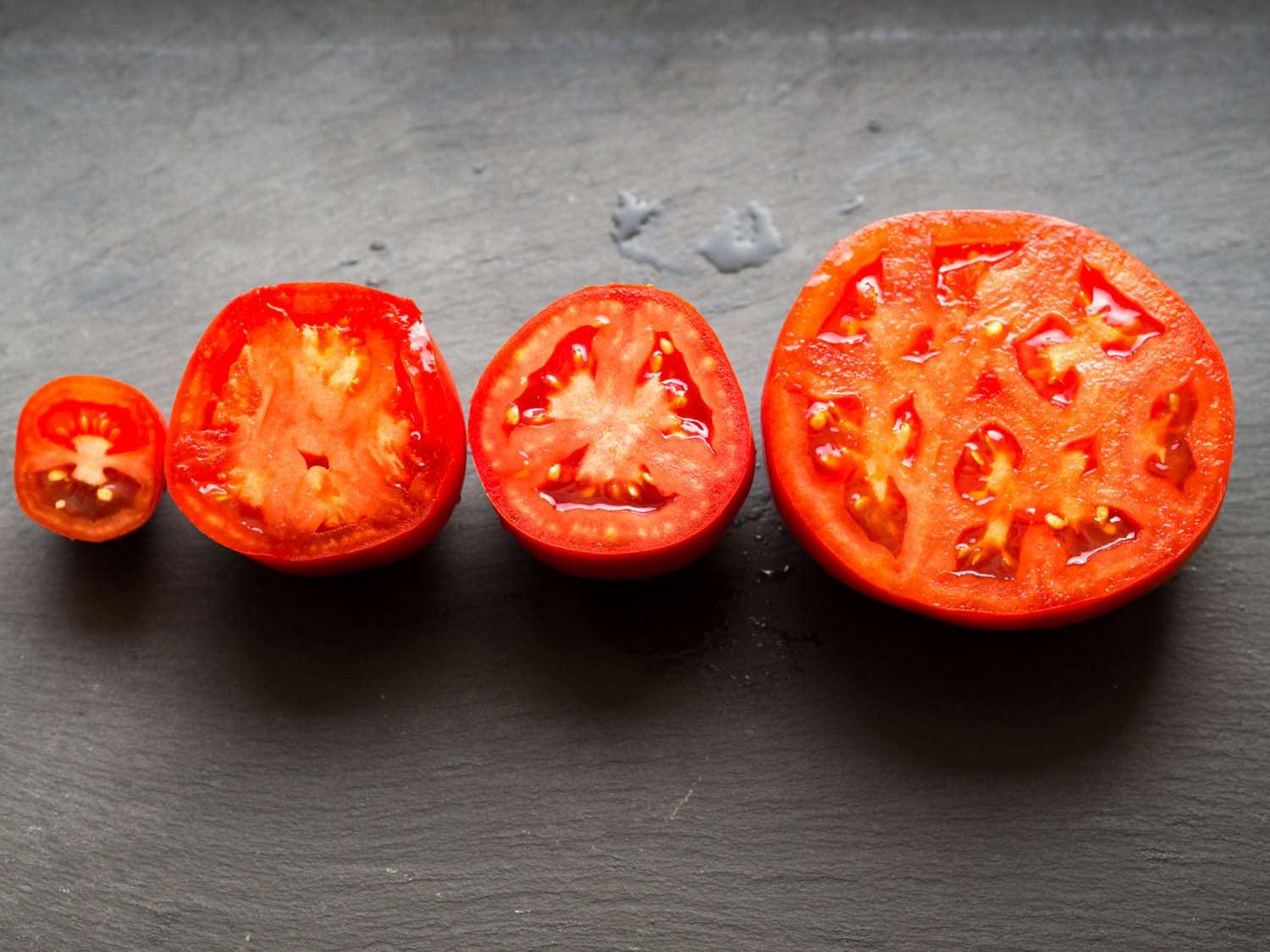 将不同品种的番茄切成两半，切面朝上
