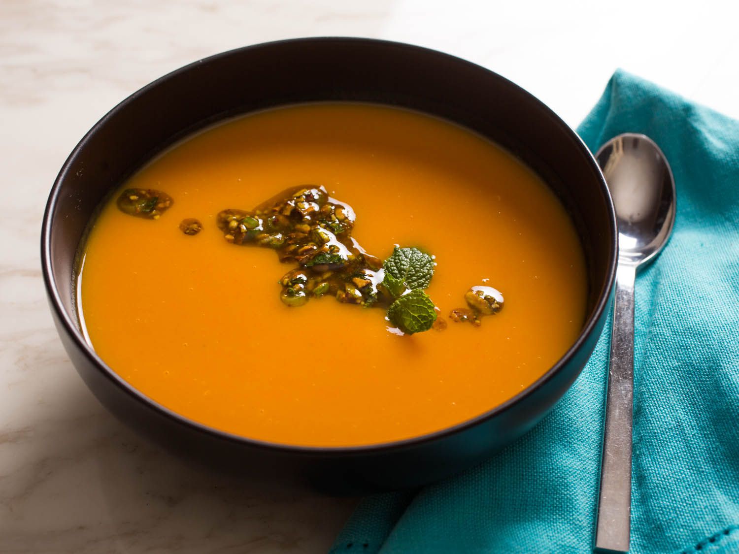 A bowl of sweet potato orange soup.