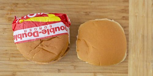 A side-by-side photo of an original In-N-Out hamburger bun and an Arnold bun.