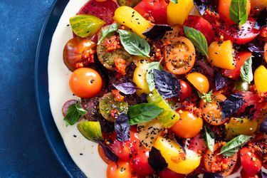 Tomato tonnato salad on a plate.