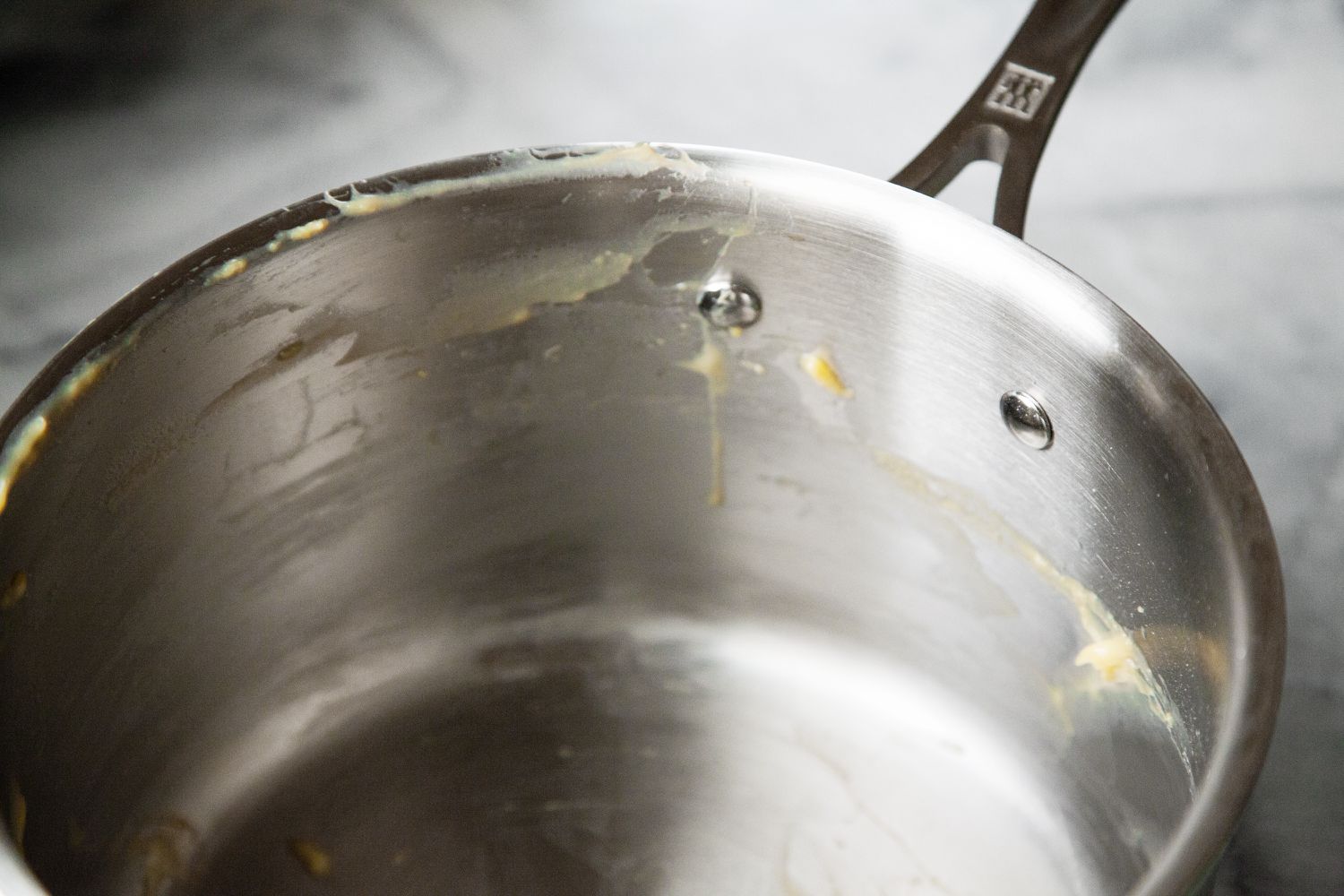 A closeup look at the interior of a stainless steel saucepan
