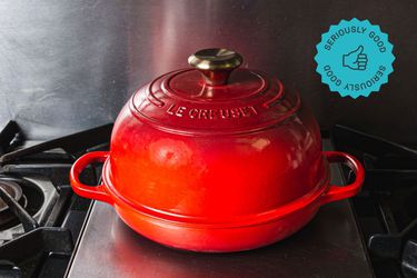 a red Le Creuset bread oven