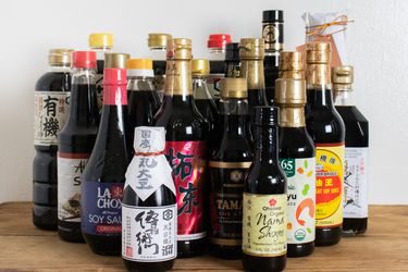 Collection of different types of soy sauces on a table
