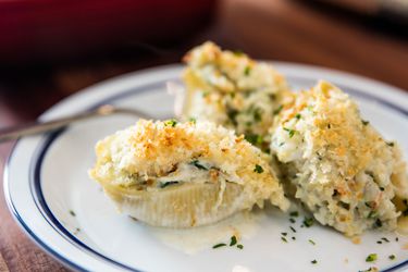 Seafood stuffed shells covered in golden breadcrumbs