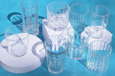a group of drinking glasses on a blue background