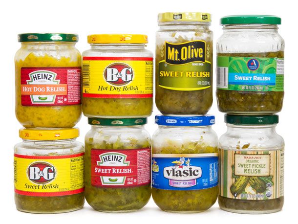 Eight pickle relishes in jars.