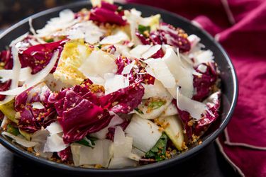 A hearty salad of radicchio, endive, and anchovies topped with shaved Parmigiano-Reggiano.