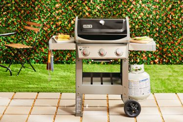 A 3-burner Weber gas grill on a patio
