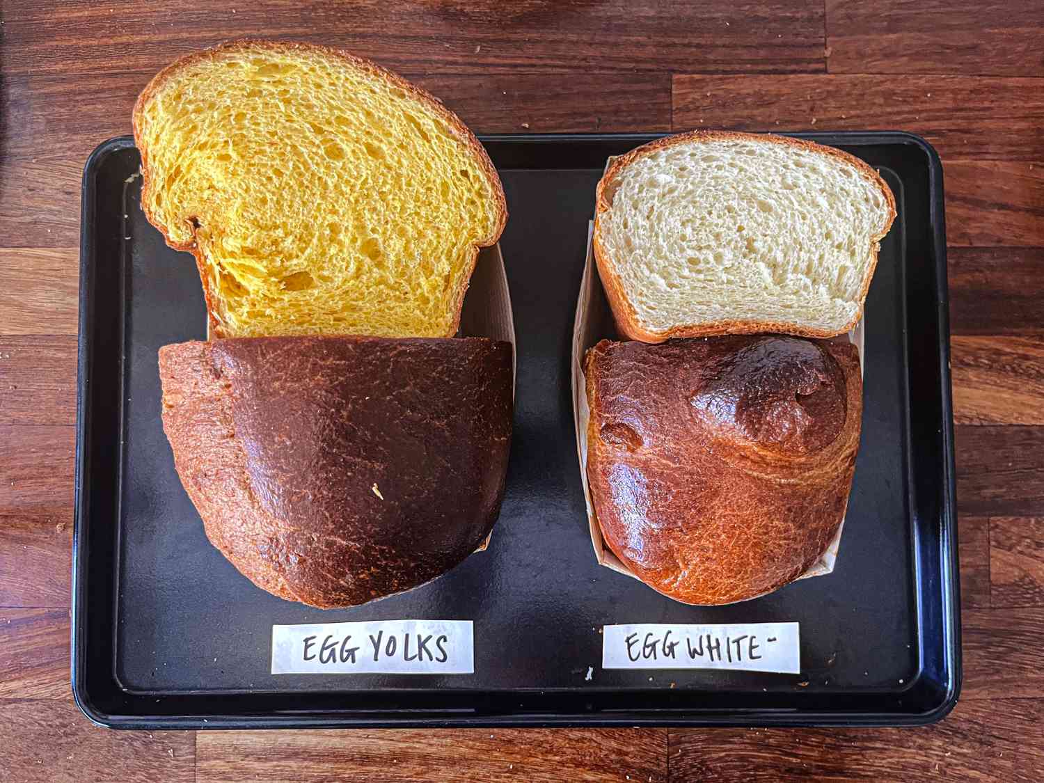 Cross section of two brioche loaves, showing the difference in texture between using just egg yolks and just egg whites
