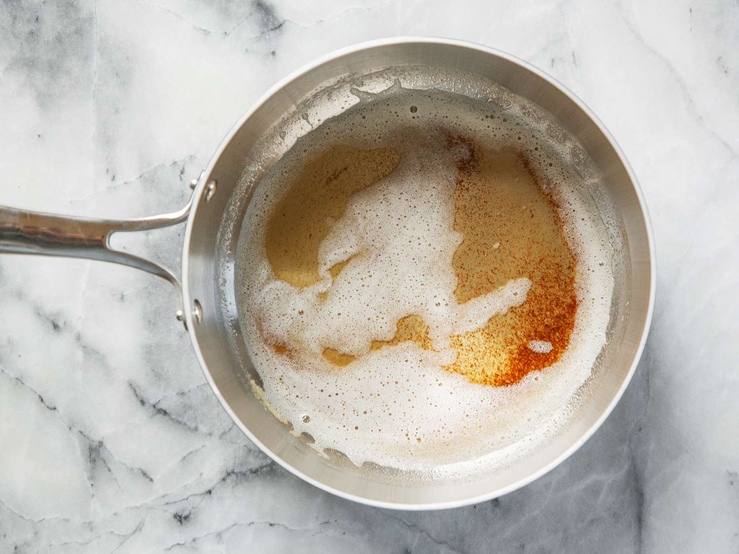 A closeup look at browned butter in a saucepan