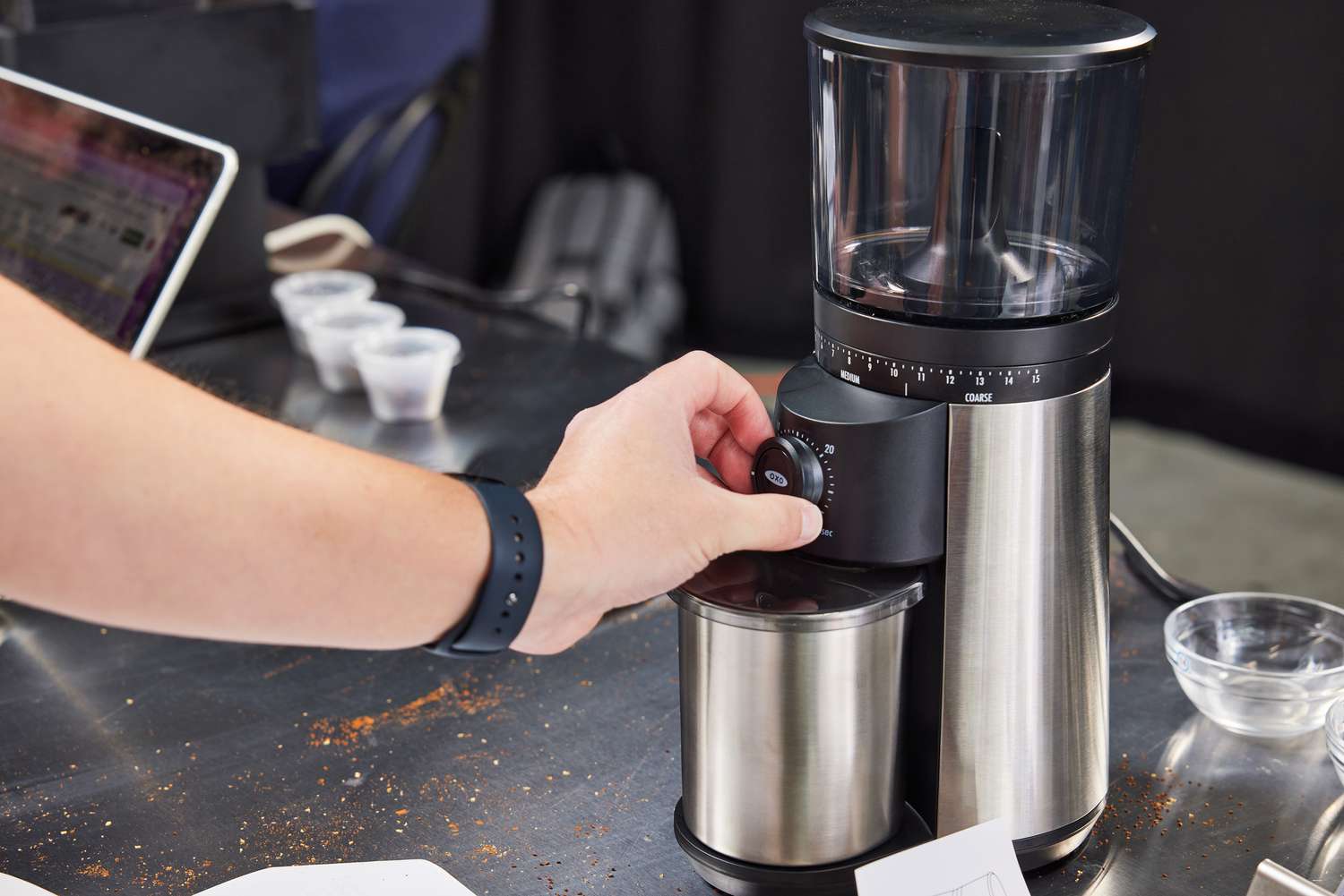 Oxo conical burr grinder being used