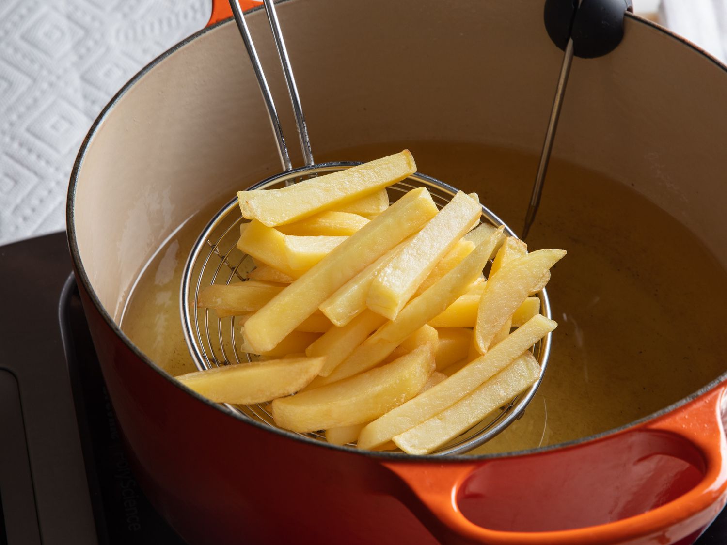 After their second fry, the French fries are very lightly golden, but still not crispy.
