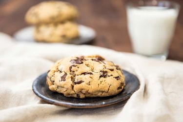 Levain Bakery-style super thick chocolate chip cookie with milk.