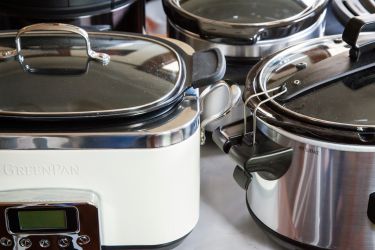slow cookers on a gray surface