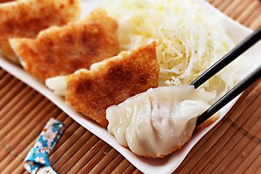 A small platter of Japanese pork and cabbage gyoza or dumplings.