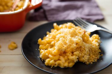 A plate of modern baked mac and cheese with cheddar and gruyère, sprinkled with bread crumbs
