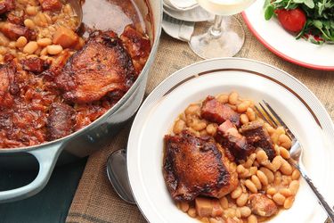 French cassoulet served out of a Dutch oven and onto a plate.