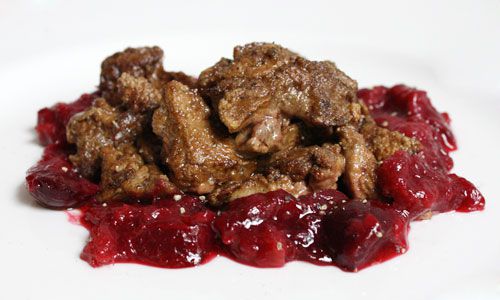 Cooked duck livers served with a rhubarb and cherry sauce.
