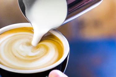 a close up of a latte being made with a non-dairy milk