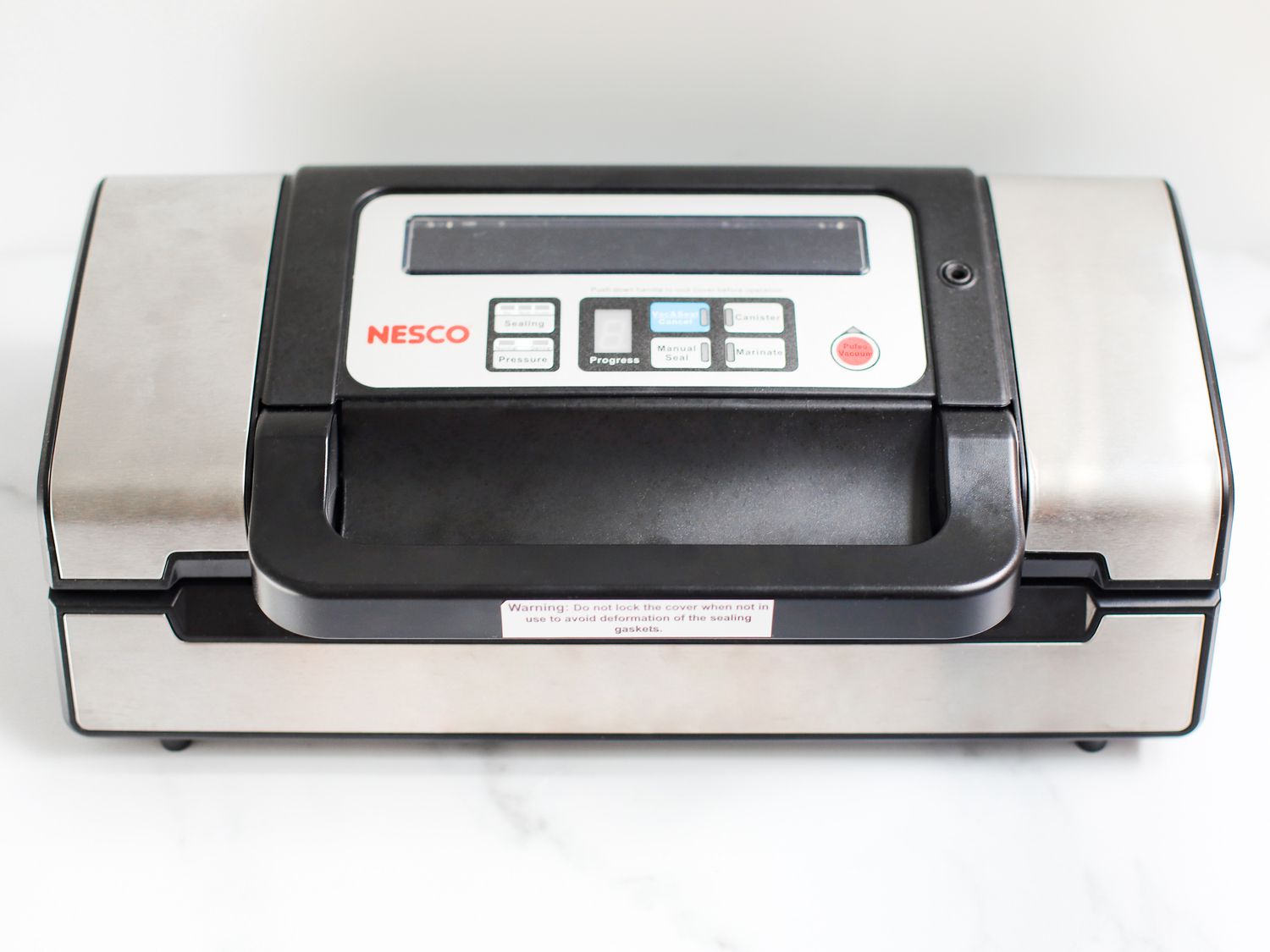 Nesco vacuum sealer on a marble countertop