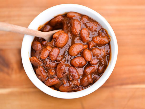 Overhead shot of a white bowl filled with barbecue beans.