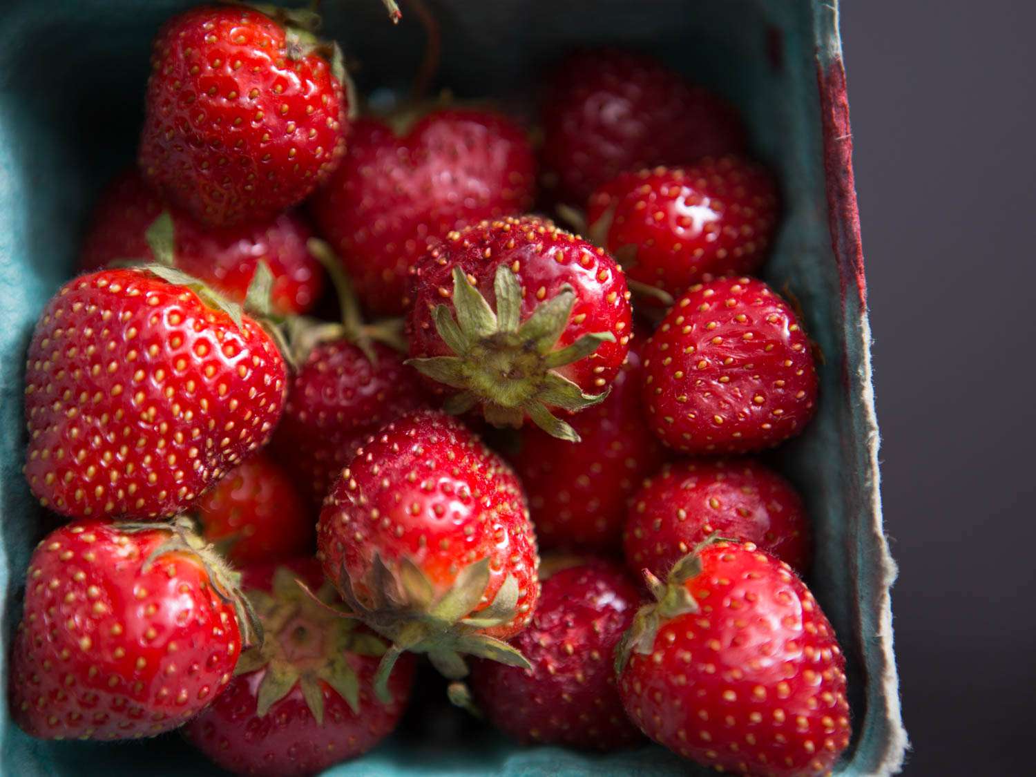 Fresh strawberries in a container.