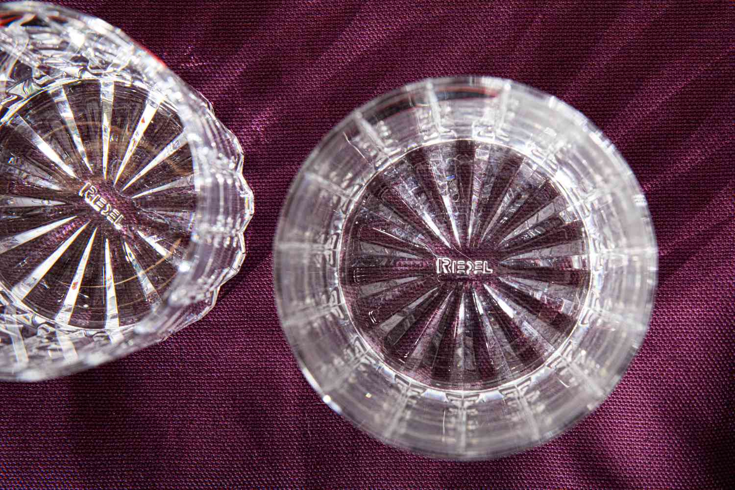 an overhead look at the bottoms of a couple of rocks glasses