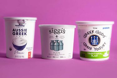 tubs of our favorite Greek yogurts against a pink background