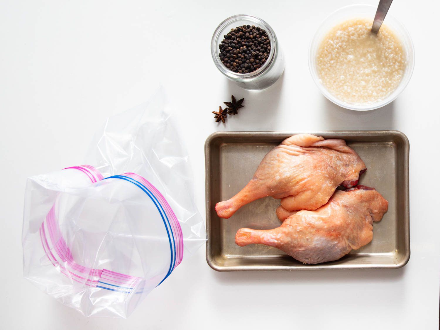Overhead of ingredients for koji-cured duck confit.