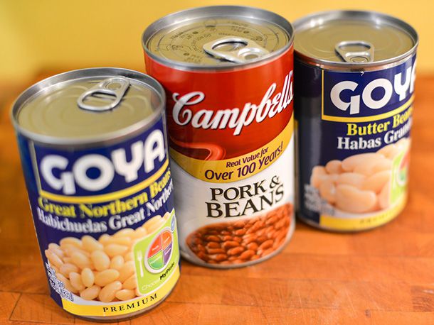 Several different brands of canned beans.